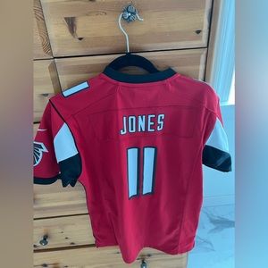 Falcons Jones jersey. Kids size L (14/16) fits like a women’s size small.